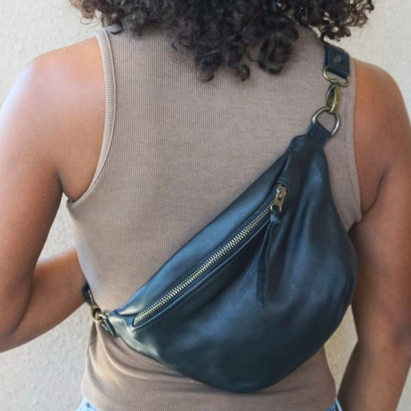 Nina Leather Sling Bag in Midnight with adjustable strap for versatile wear, crafted by artisans in Guatemala