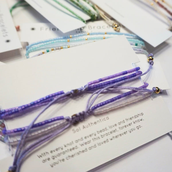 Handcrafted friendship bracelets with double strands of miyuki beads, packaged with a heartfelt Sol Sister poem.