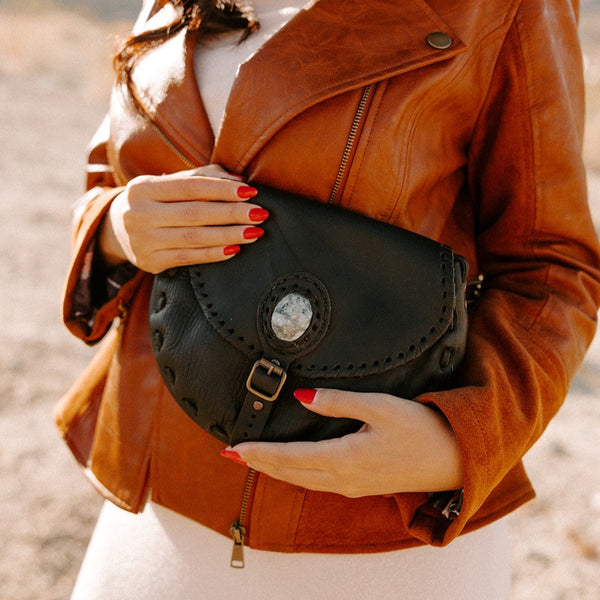 Expert artisan-crafted leather purse with jade for strength and luck in Panajachel, Guatemala