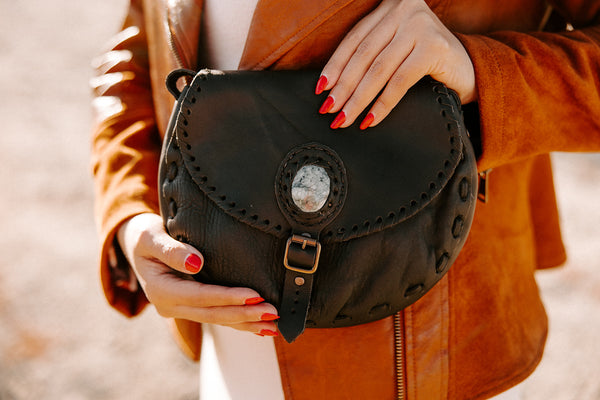 Vida Leather & Jade Saddlebag in black with adjustable strap and jade stone accent