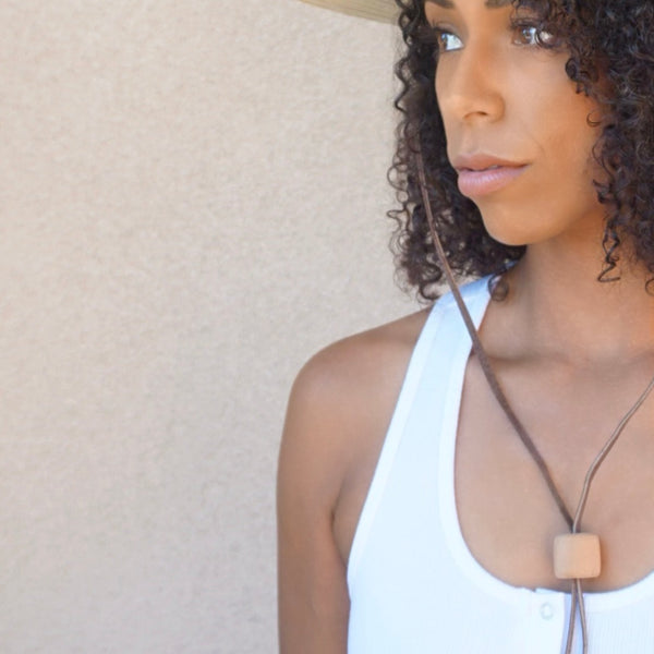 Sustainably crafted Riley palm hat with wooden toggle, perfect for sun protection