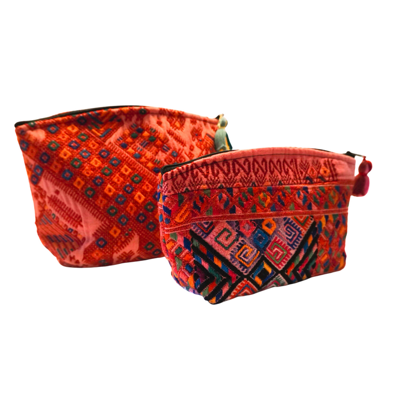 Set of two embroidered cosmetic bags, handcrafted in Panajachel, Guatemala, featuring vibrant upcycled huipil fabric.
