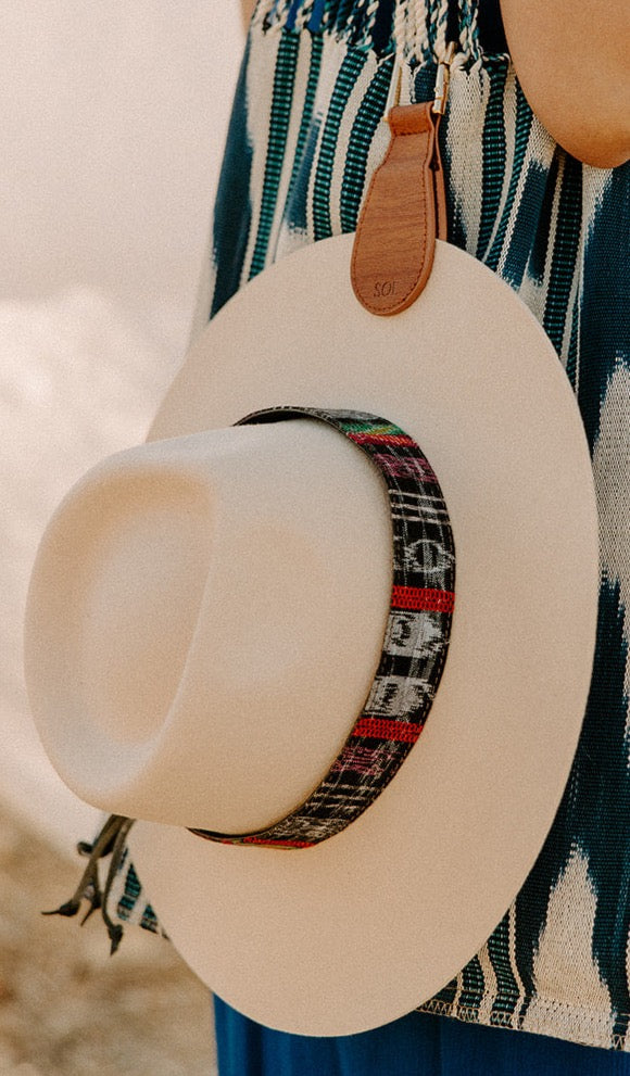Transform your hat's look with the Wide Upcycled Corte Hat Band from Sol Authentica, crafted in Santo Domingo Xenacoj, Guatemala.