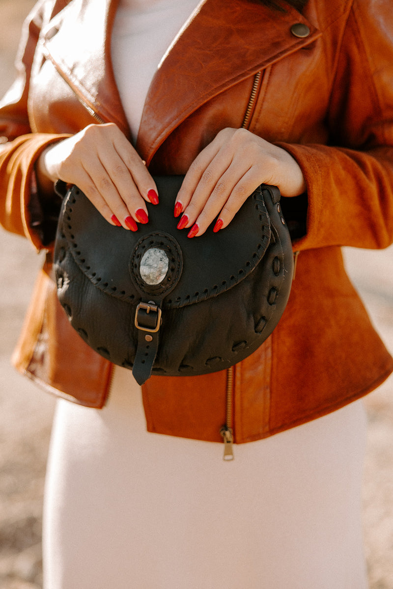This high-quality leather purse features a jade accent for strength and luck. 