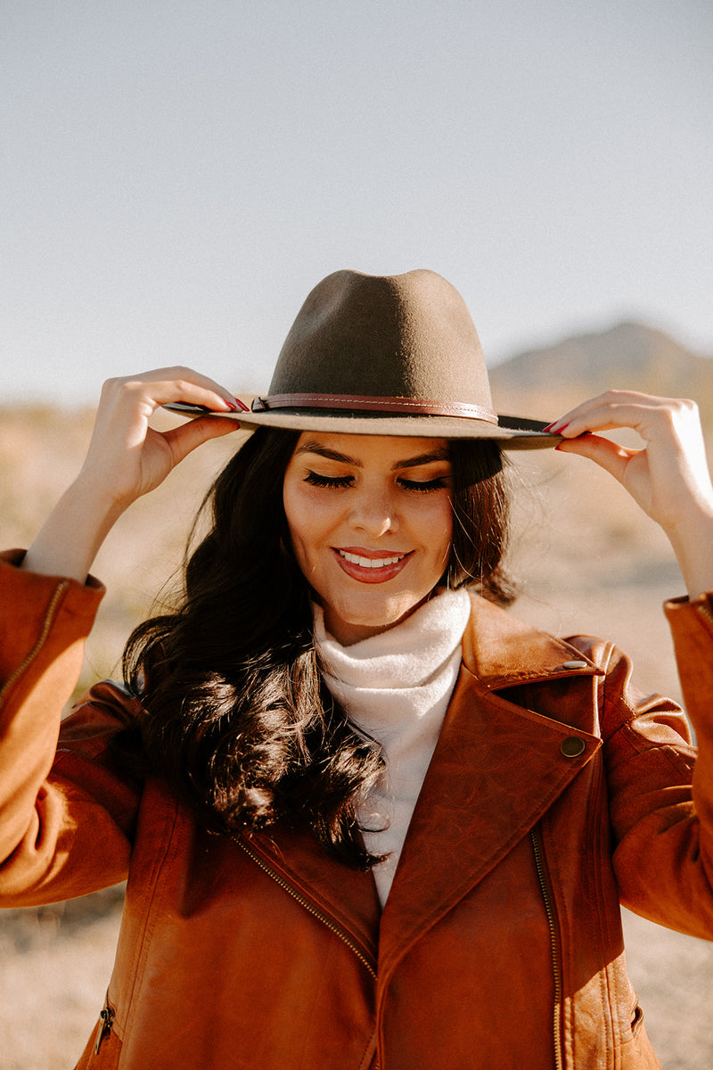 Stay stylish on your adventures with the Olive rancher hat, including a removable leather headband for versatility.