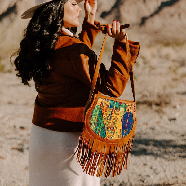 Unique leather crossbody bag with vibrant huipil embroidery by Sol Authentica