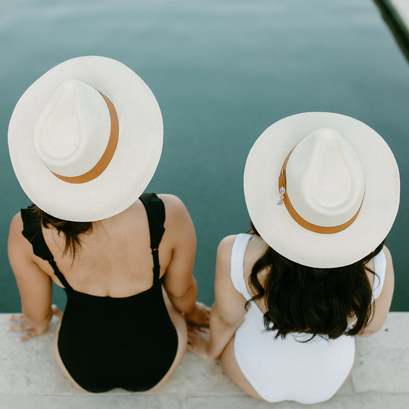 Stay shaded in style with the Isla Rae Beach Hat, featuring an upcycled grosgrain band and a multifunctional quartz and agate pin, handcrafted by Sol Authentica.